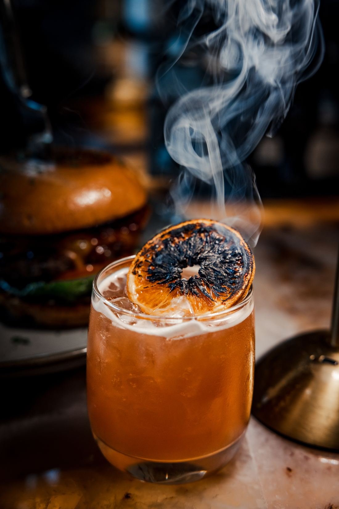 Cocktail with a charred citrus garnish