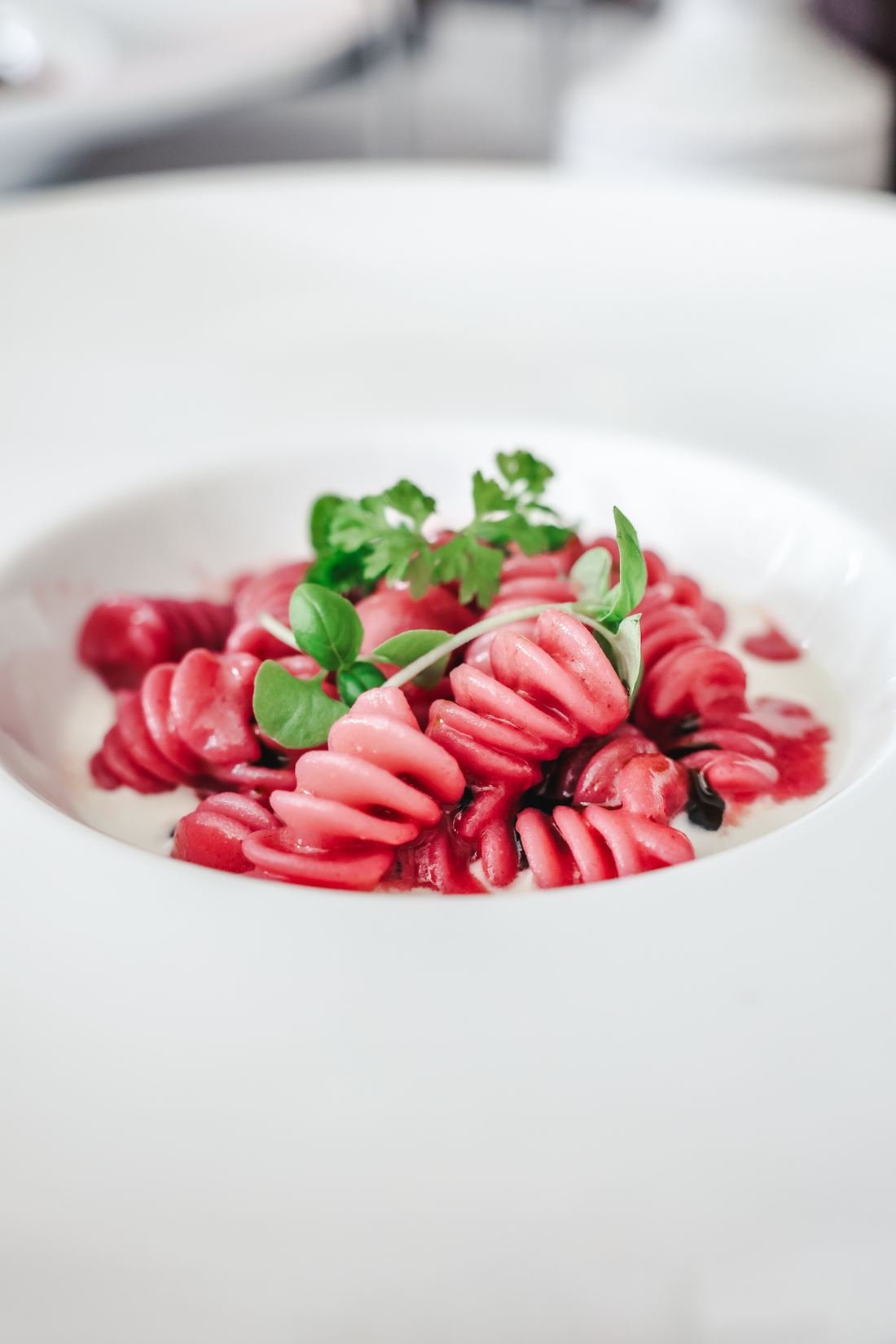 Beet pasta spirals in a cream sauce